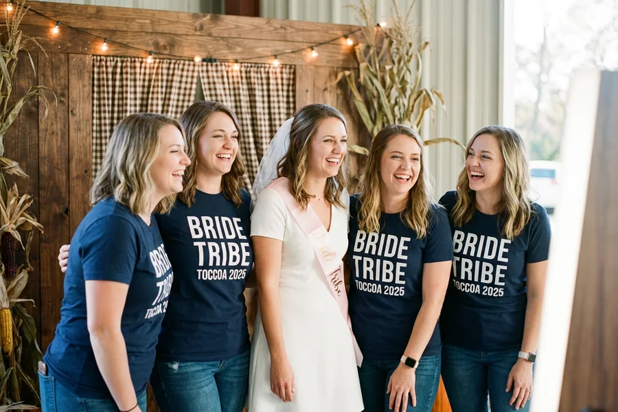 The Toccoa Bachelorette Party: five white women in their late 20s, matching navy t-shirts reading 